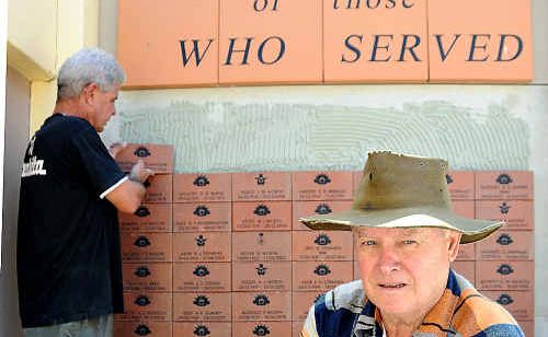 Rod Strahan holds the late Joan Hockins paver while Wayne Sellick adds another brick to the Memorial Wall. Rod Strahan holds the late Joan Hockins paver while Wayne Sellick adds another brick to the Memorial Wall.